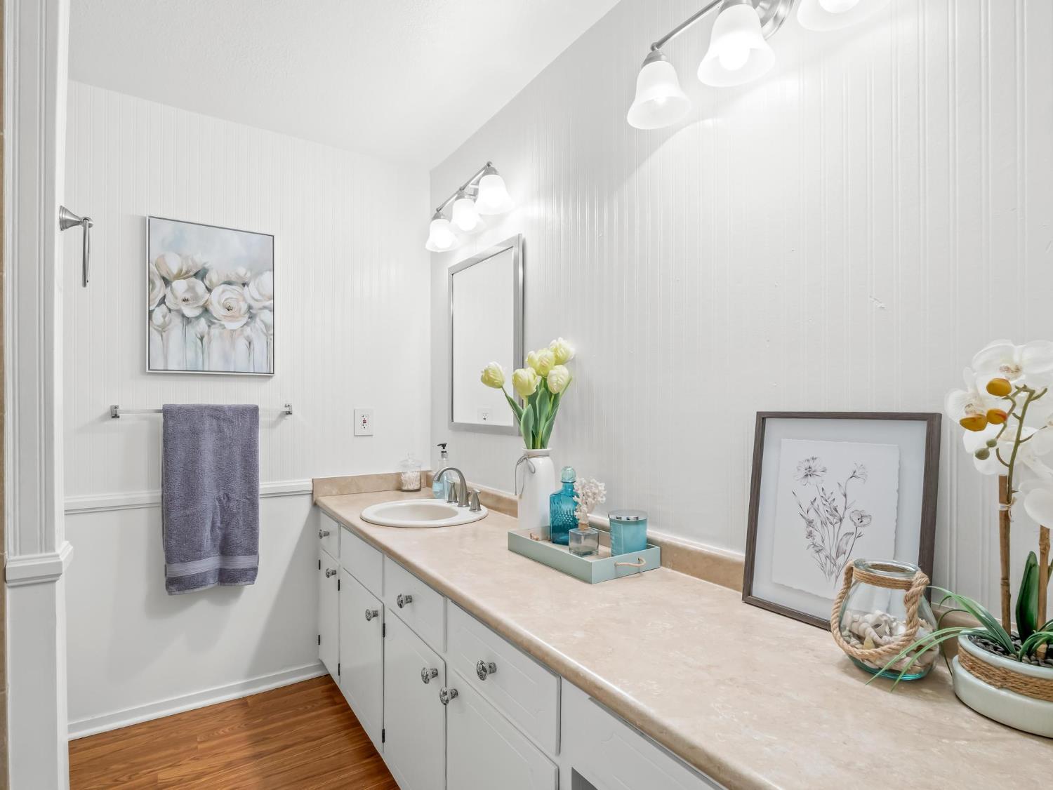 873 Cedar Lane Lemoore, CA 93245 - Photo 37 of 41 a bathroom with a granite countertop sink a potted plant and a mirror