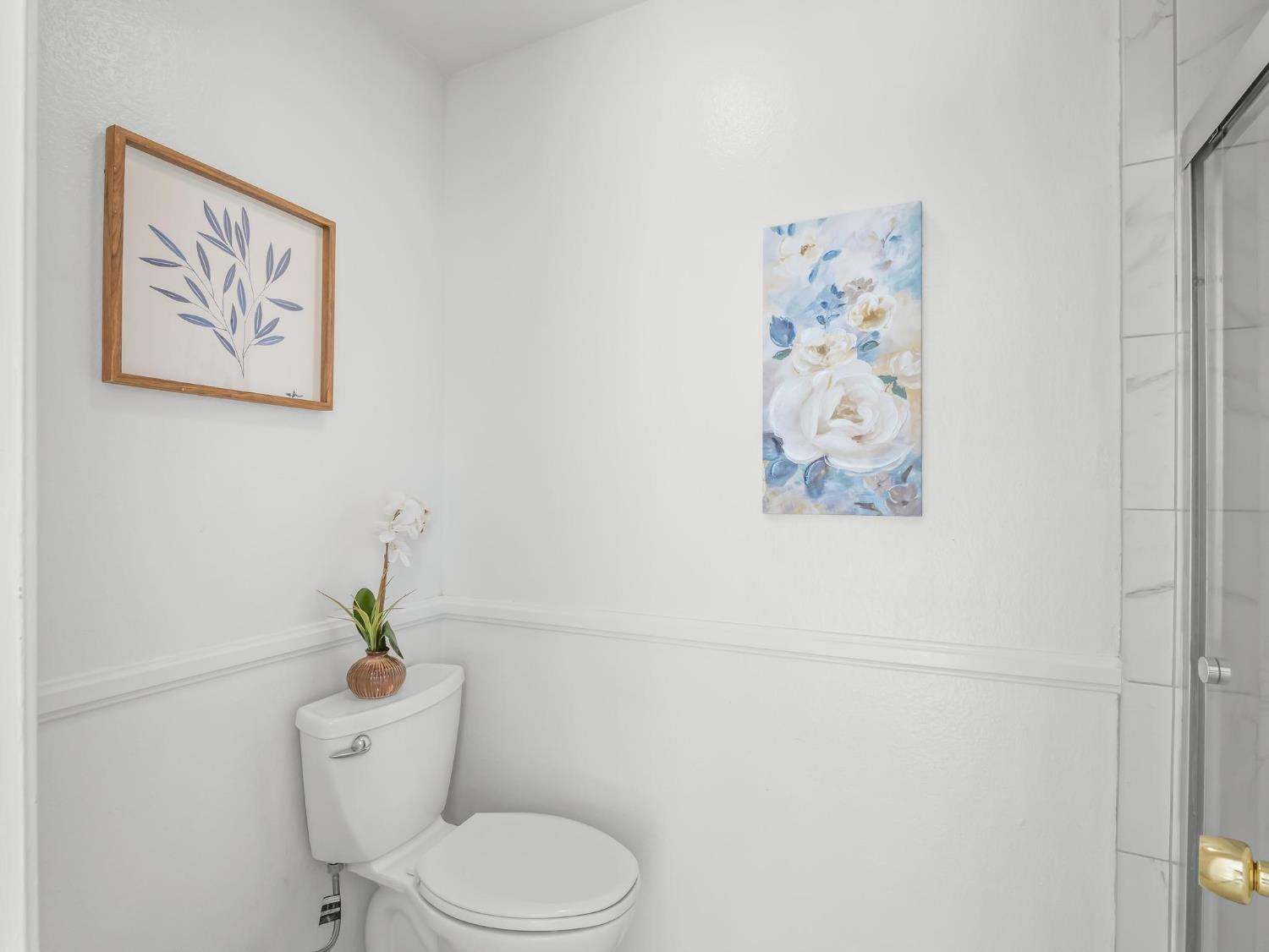 873 Cedar Lane Lemoore, CA 93245 - Photo 38 of 41 a white toilet sitting next to a white wall