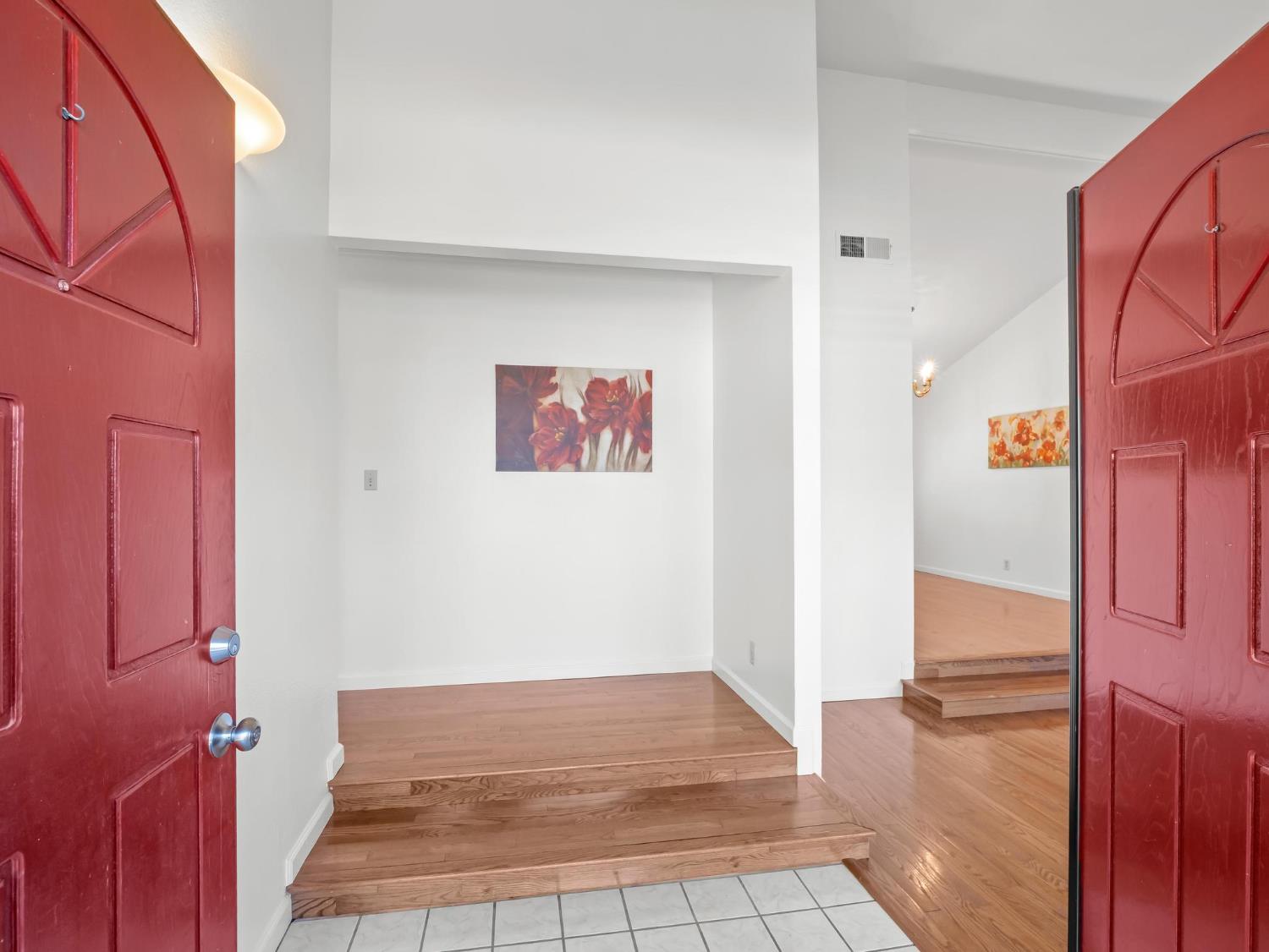 873 Cedar Lane Lemoore, CA 93245 - Photo 9 of 41 a view of a hallway with wooden floor and cabinet