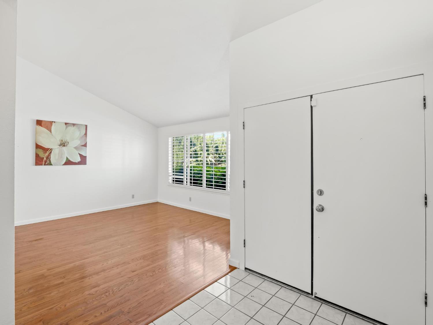 873 Cedar Lane Lemoore, CA 93245 - Photo 10 of 41 a view of an empty room with a window