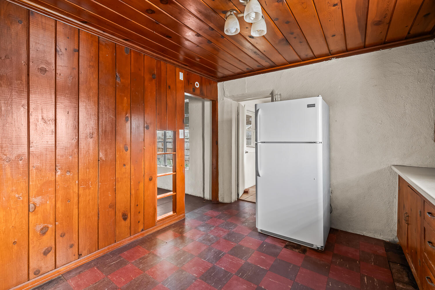 2124 29th Street, Unit REAR Lubbock, TX 79411 - Photo 4 of 10 a view of a storage & utility room with a fridge