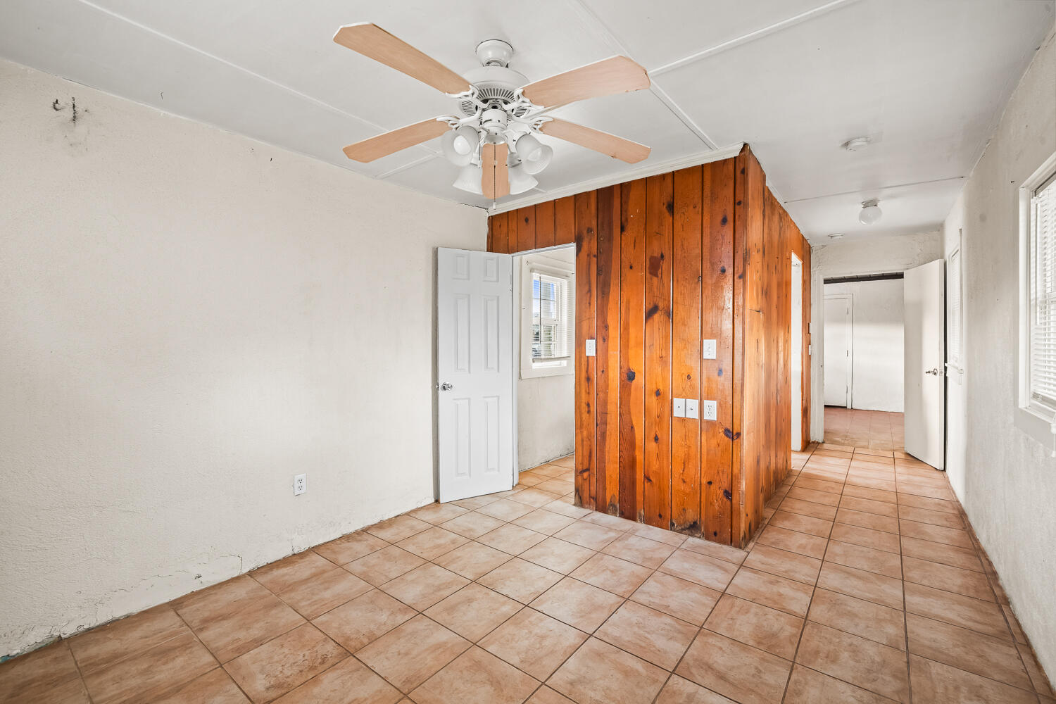 2124 29th Street, Unit REAR Lubbock, TX 79411 - Photo 5 of 10 a view of a hallway with a chandelier fan
