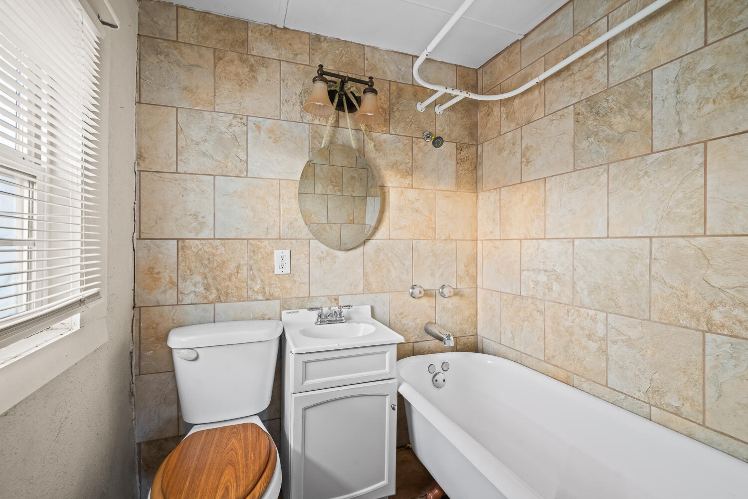 2124 29th Street, Unit REAR Lubbock, TX 79411 - Photo 6 of 10 a bathroom with a sink a toilet and shower