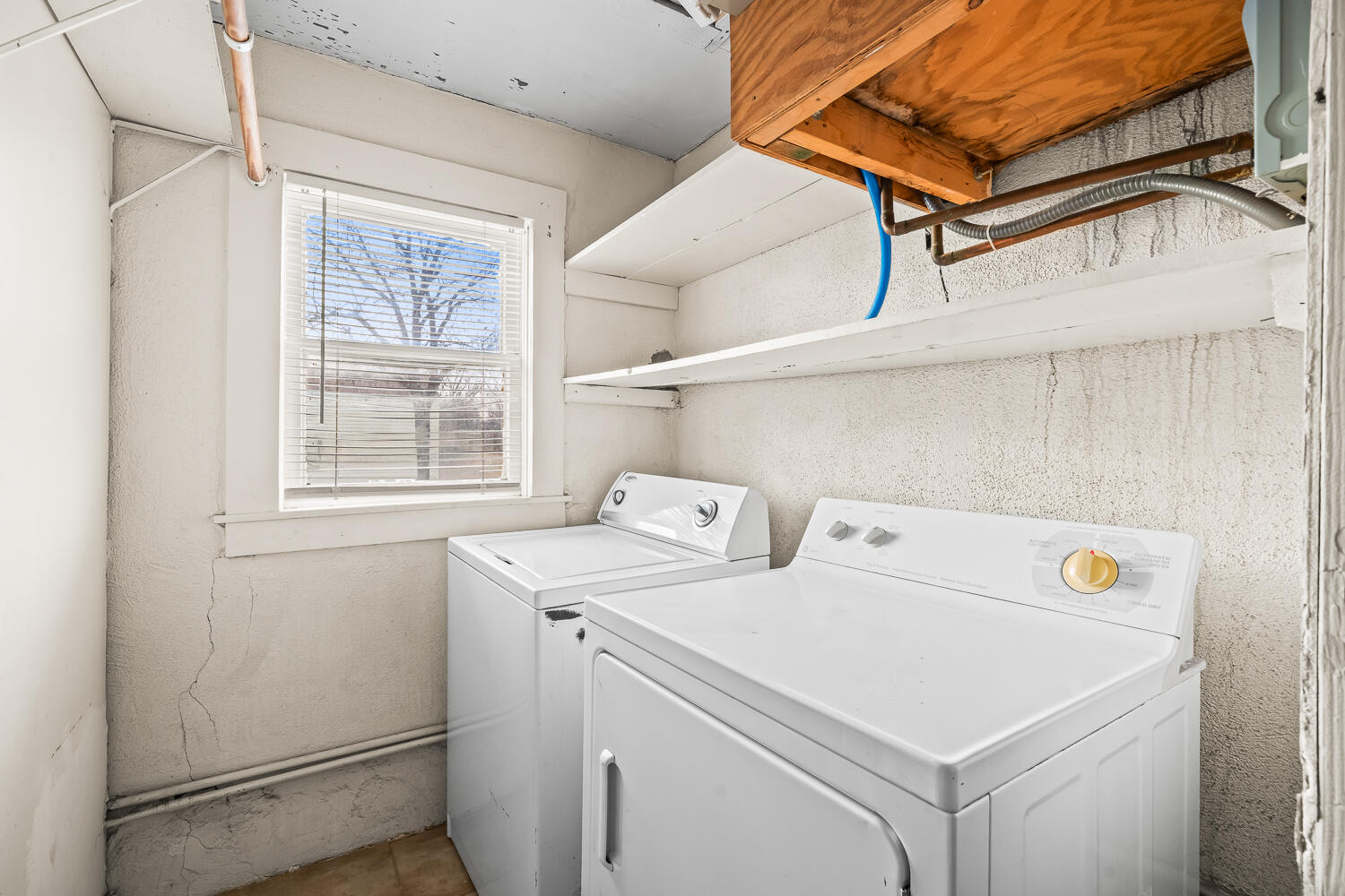 2124 29th Street, Unit REAR Lubbock, TX 79411 - Photo 7 of 10 a utility room with dryer and washer