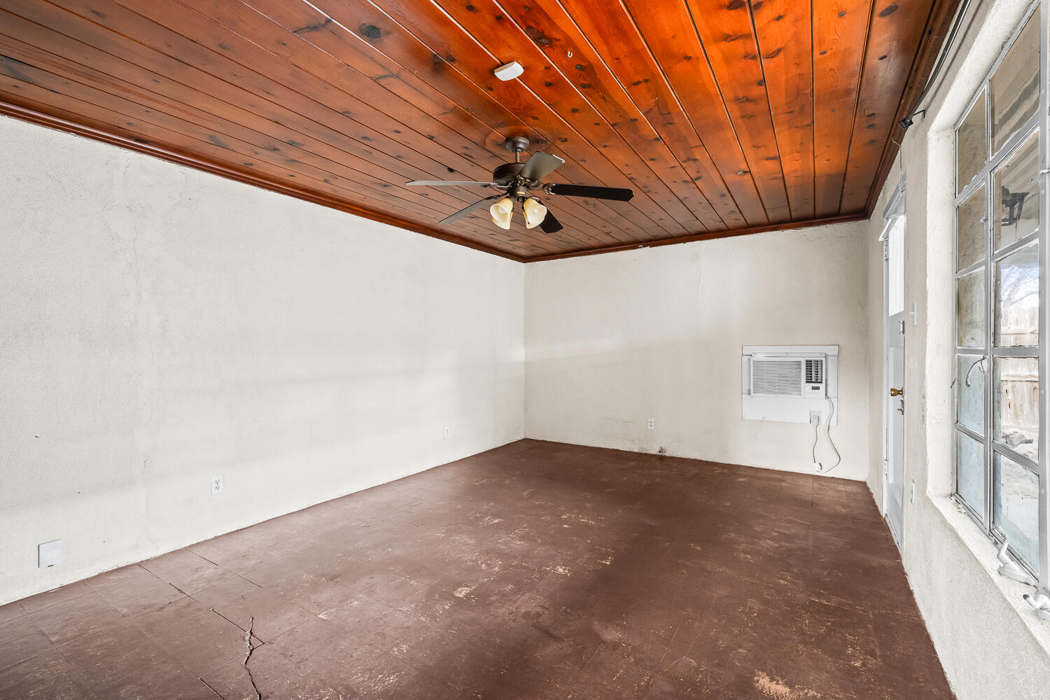 2124 29th Street, Unit REAR Lubbock, TX 79411 - Photo 8 of 10 a view of an empty room with a window