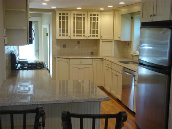 72 Cleveland Way Wareham, MA 02532 - Photo 3 of 27 a kitchen with stainless steel appliances granite countertop a refrigerator a sink and a stove