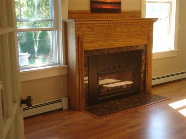 72 Cleveland Way Wareham, MA 02532 - Photo 8 of 27 a living room with a fireplace