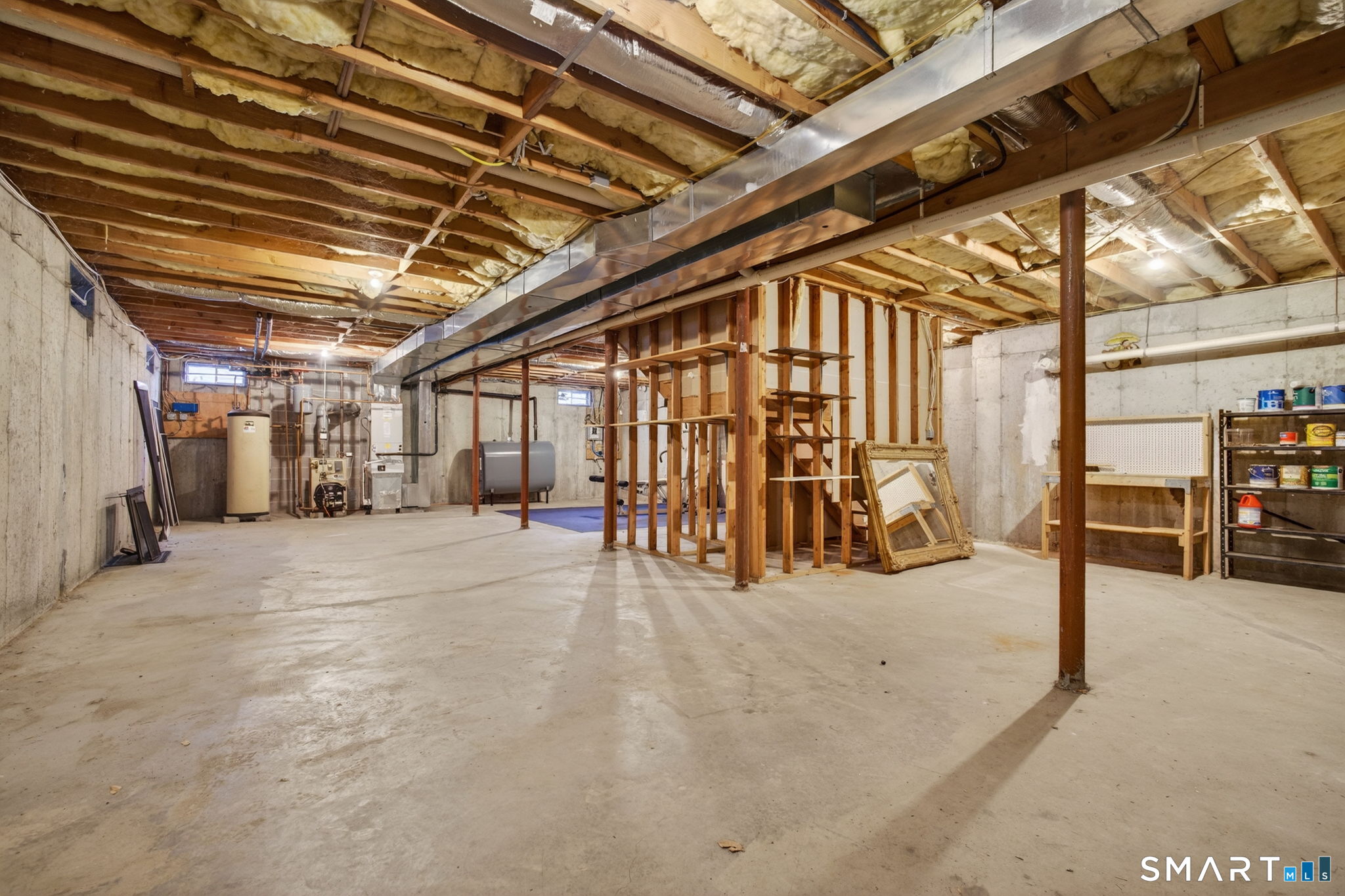 149 Ford Road Woodbridge, CT 06525 - Photo 37 of 41 UNFINISHED BASEMENT WITH TALL CEILING HEIGHT
