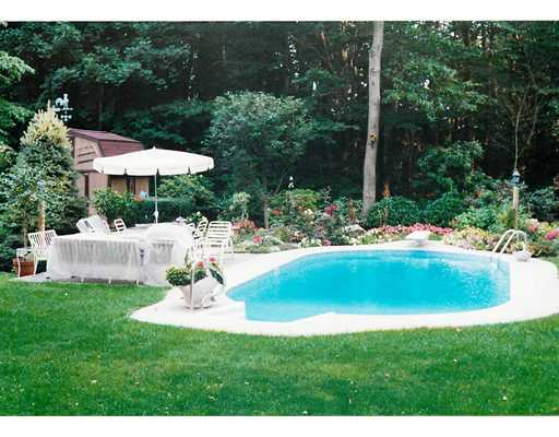 242 Pemberwick Road Greenwich, CT 06831 - Photo 10 of 10 a swimming pool with outdoor seating and yard