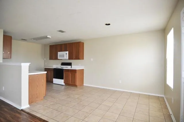 a kitchen with stainless steel appliances a sink stove and cabinets
