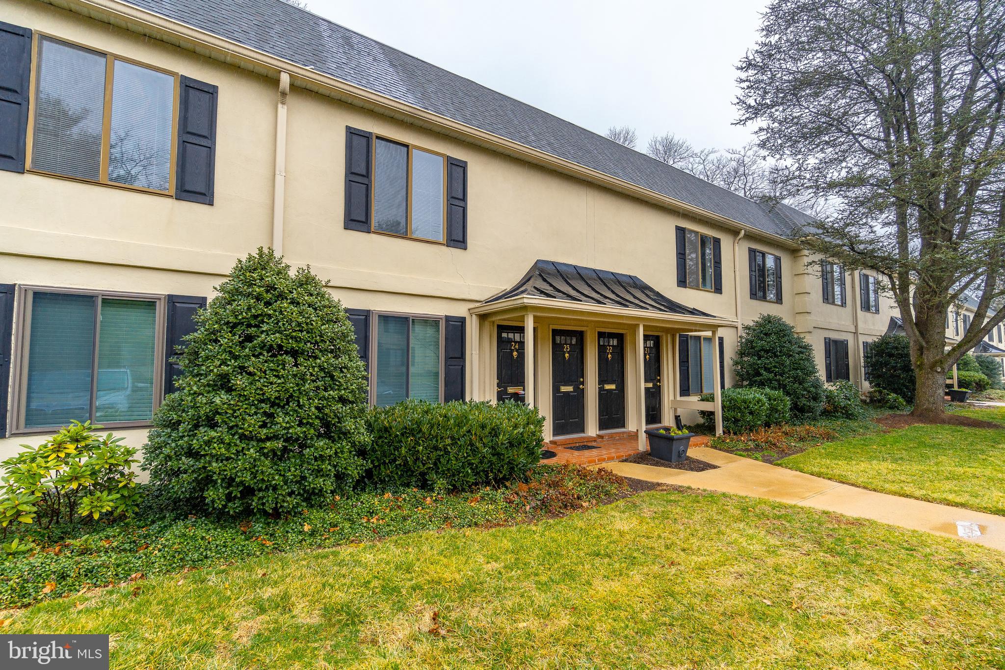 411 Conestoga Road, Unit 22 Devon, PA 19333 - Photo 2 of 27 a front view of a house with a yard