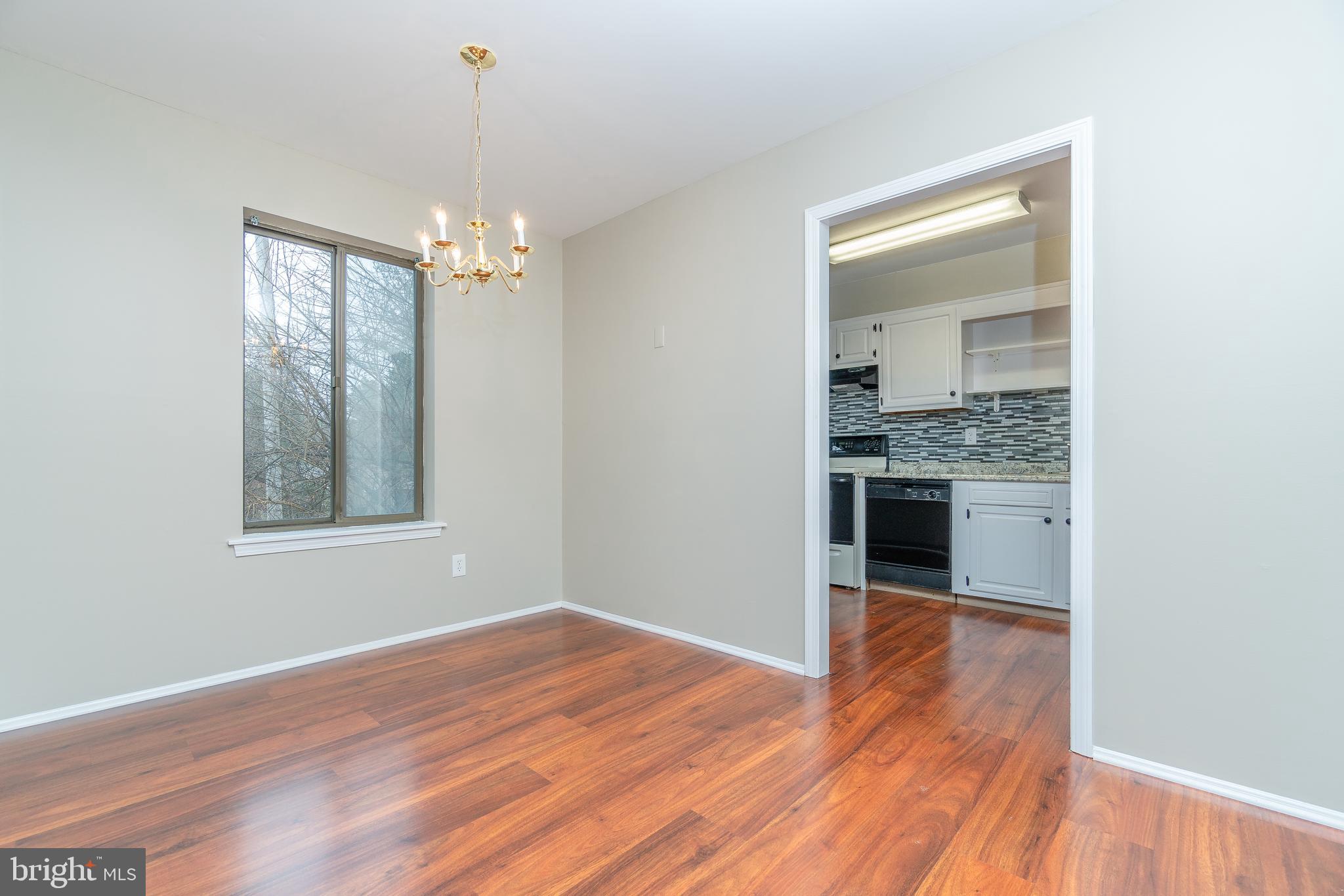 411 Conestoga Road, Unit 22 Devon, PA 19333 - Photo 11 of 27 a view of a kitchen with a sink wooden floor and a window