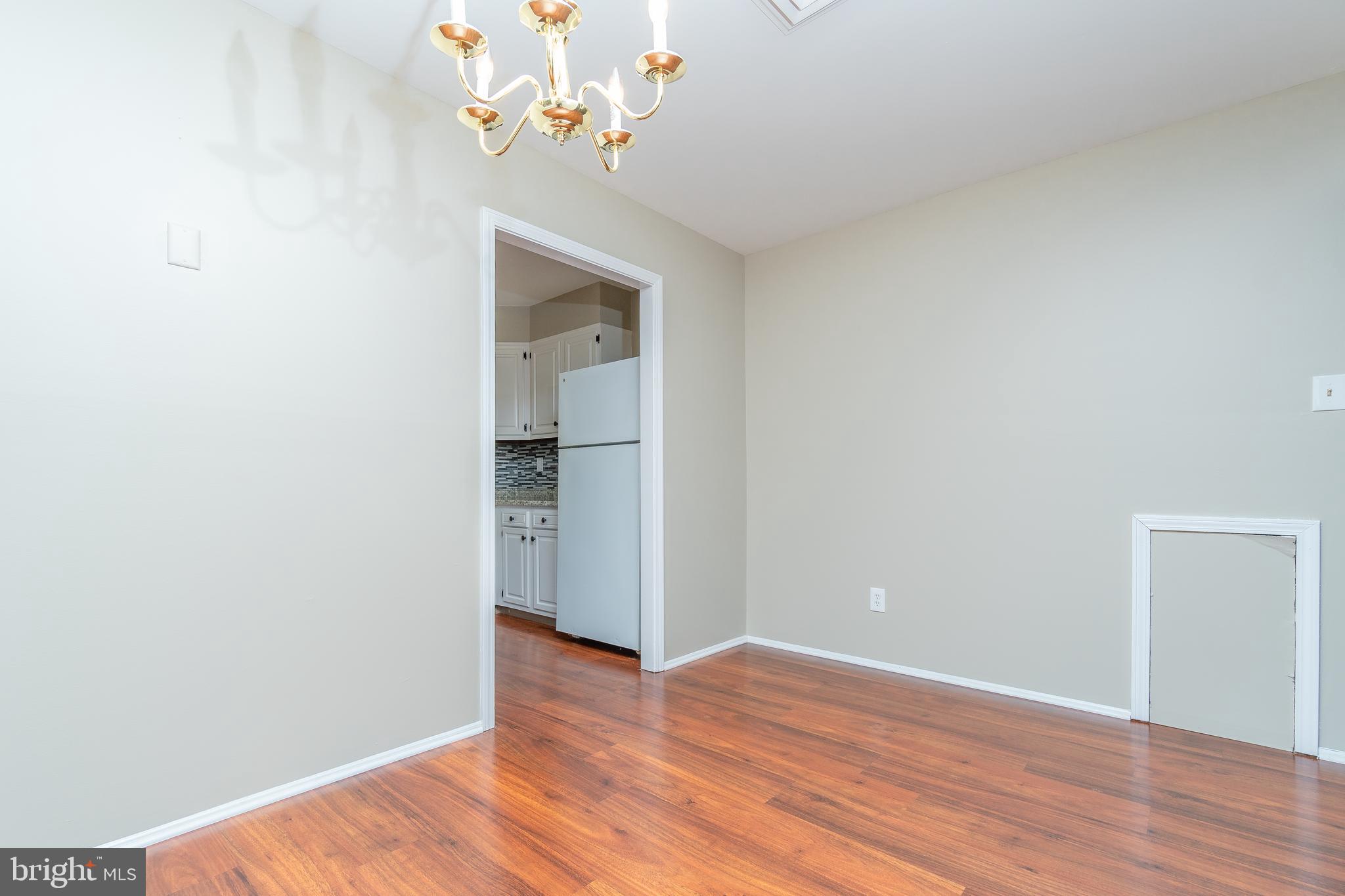 411 Conestoga Road, Unit 22 Devon, PA 19333 - Photo 13 of 27 a view of an empty room with wooden floor