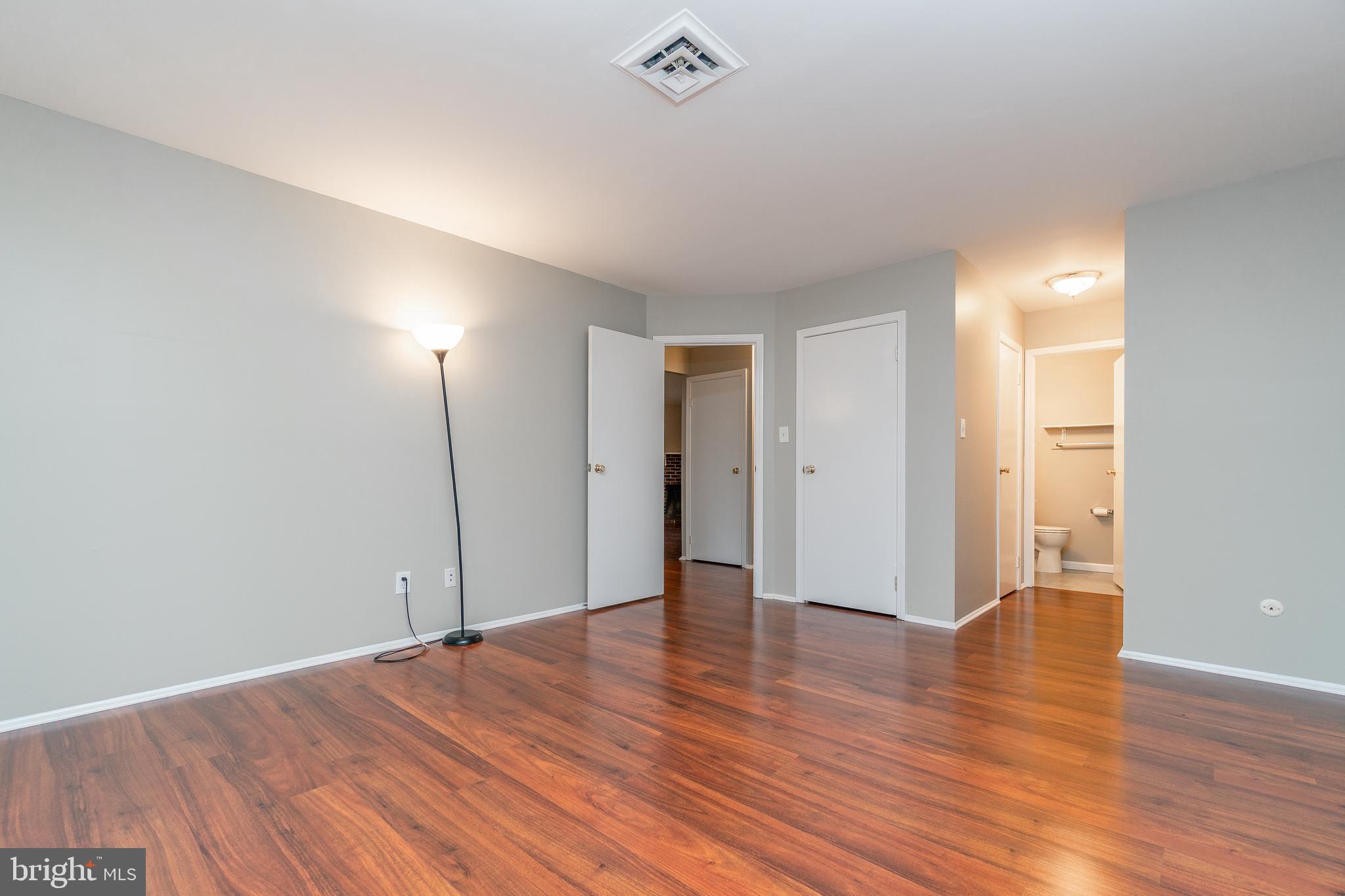 411 Conestoga Road, Unit 22 Devon, PA 19333 - Photo 20 of 27 a view of an empty room with wooden floor