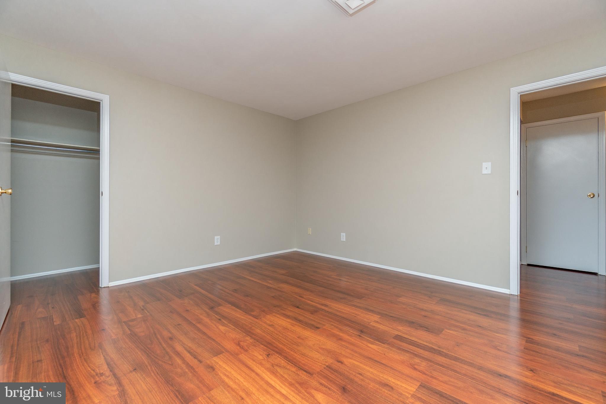 411 Conestoga Road, Unit 22 Devon, PA 19333 - Photo 24 of 27 a view of an empty room with wooden floor and closet
