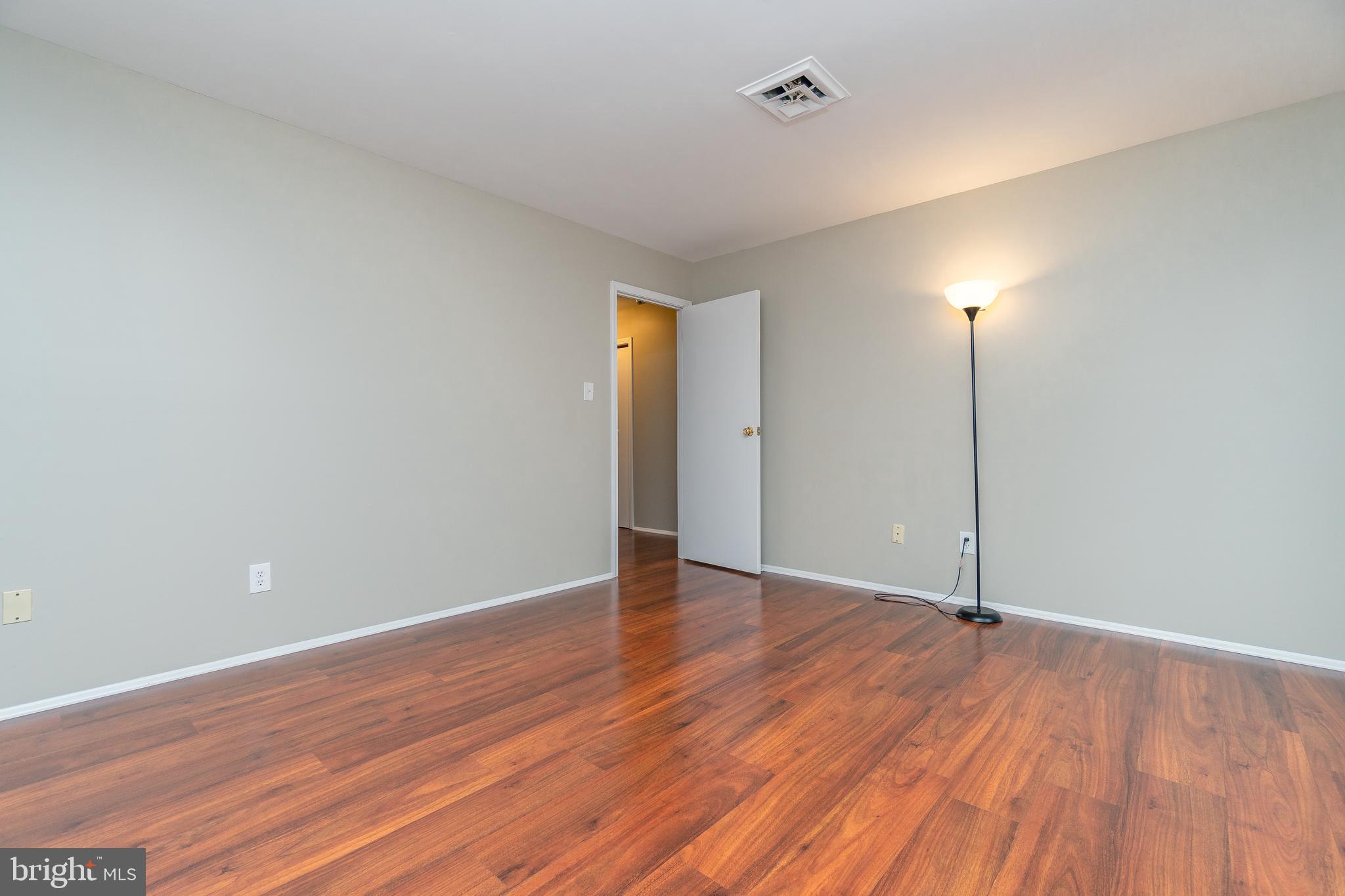 411 Conestoga Road, Unit 22 Devon, PA 19333 - Photo 25 of 27 a view of an empty room with wooden floor