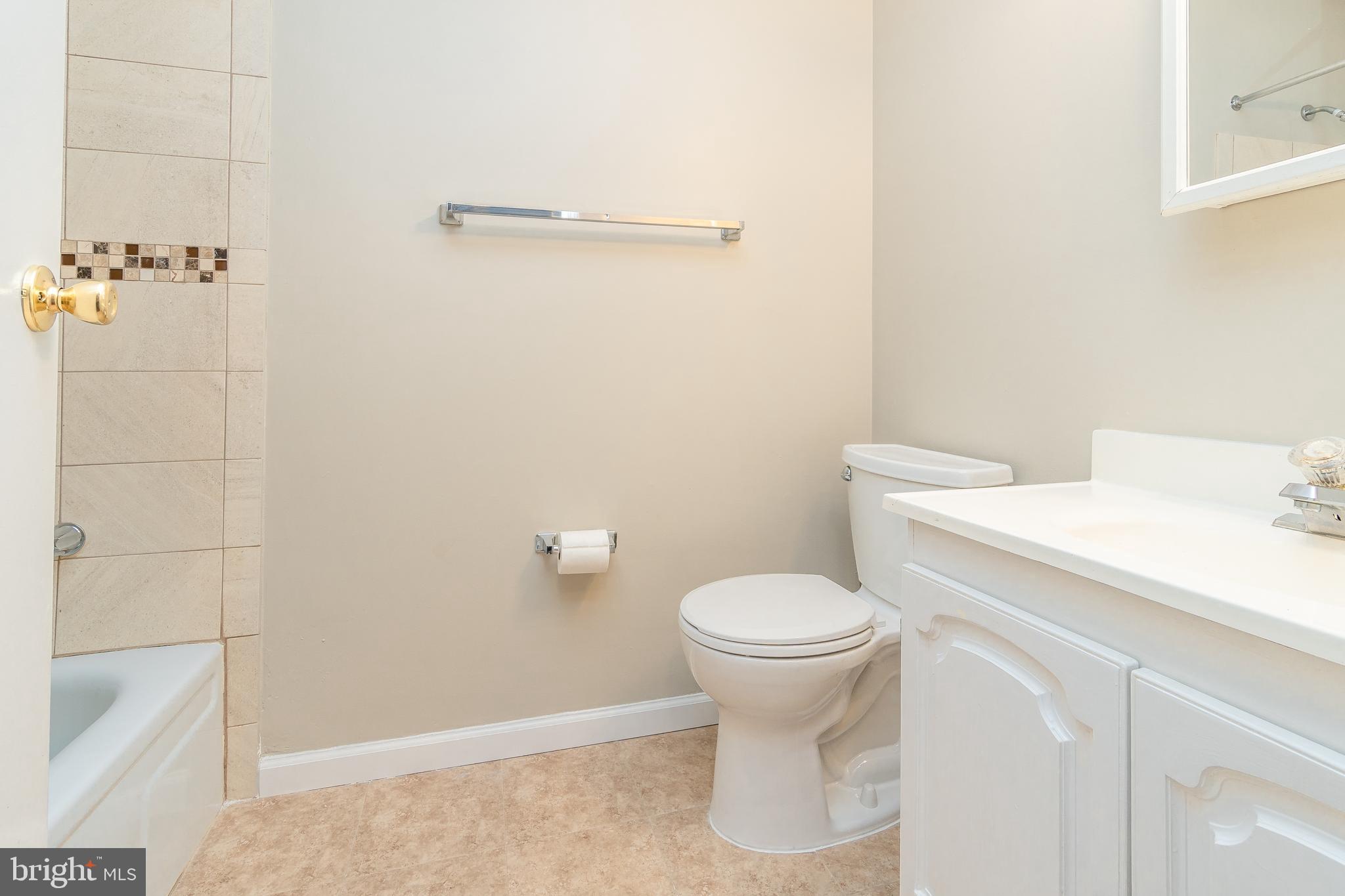 411 Conestoga Road, Unit 22 Devon, PA 19333 - Photo 27 of 27 a white toilet sitting next to a bathroom sink