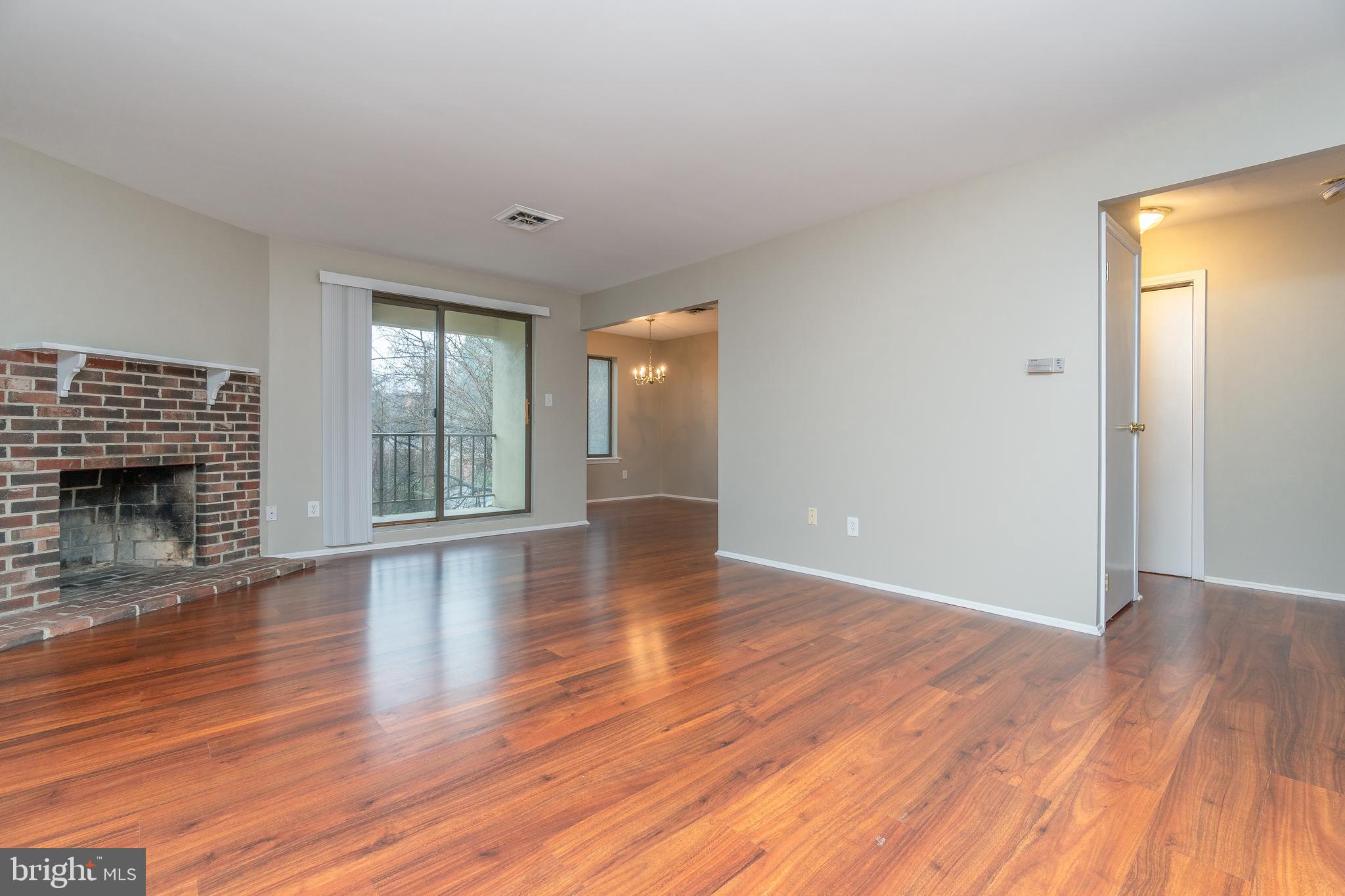 411 Conestoga Road, Unit 22 Devon, PA 19333 - Photo 6 of 27 a view of an empty room with wooden floor and a window