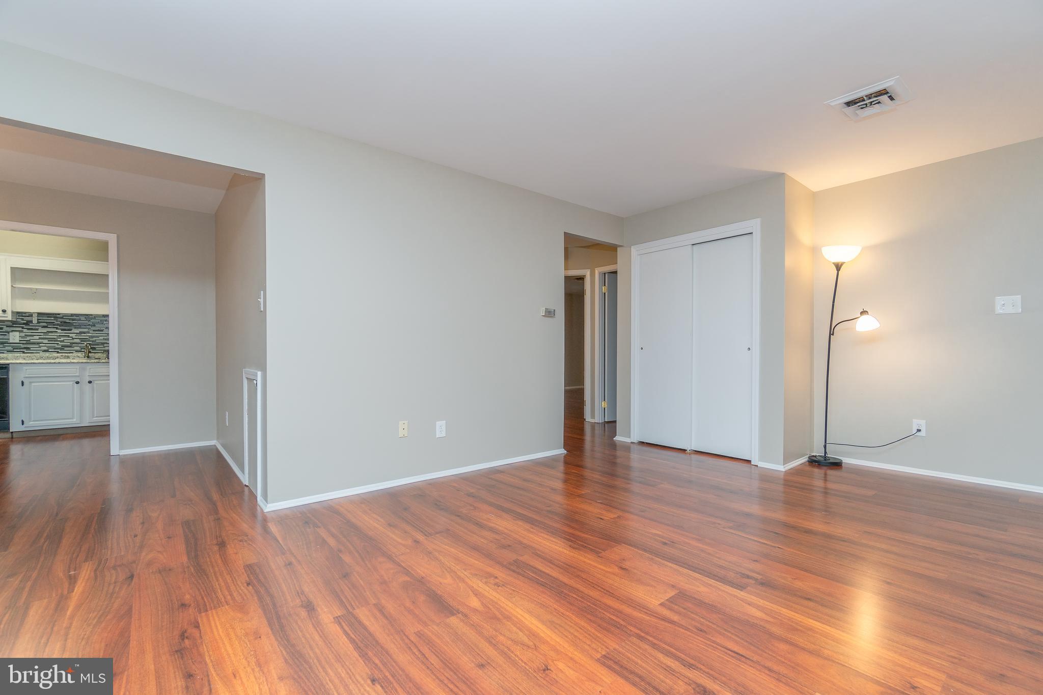 411 Conestoga Road, Unit 22 Devon, PA 19333 - Photo 8 of 27 a view of an empty room and wooden floor