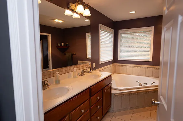 a bathroom with a bathtub and a sink