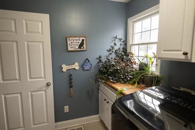 a view of a livingroom with furniture and a window