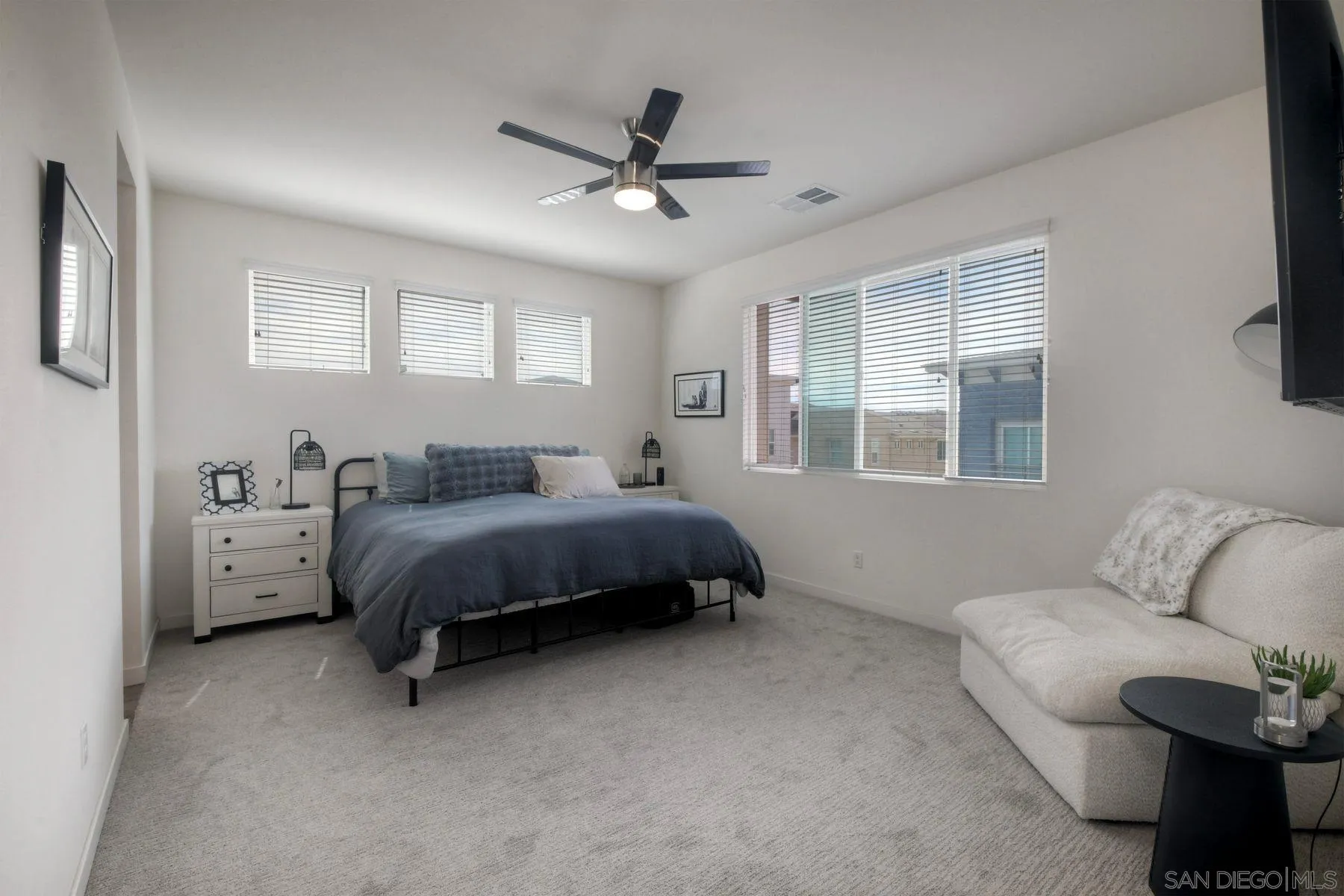 6058 Colt Place, Unit 101 Carlsbad, CA 92009 - Photo 11 of 42 a spacious bedroom with a bed and window