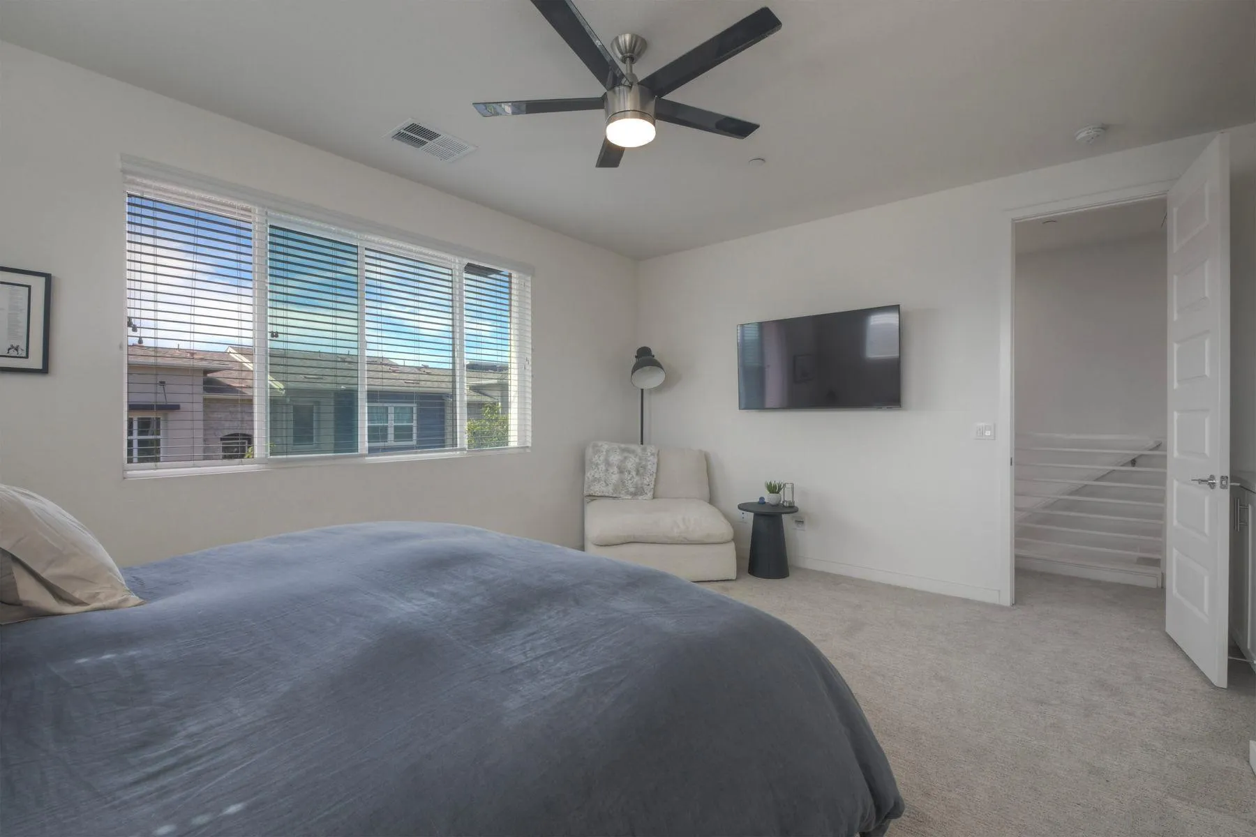 6058 Colt Place, Unit 101 Carlsbad, CA 92009 - Photo 12 of 42 a bedroom with a bed and a flat screen tv