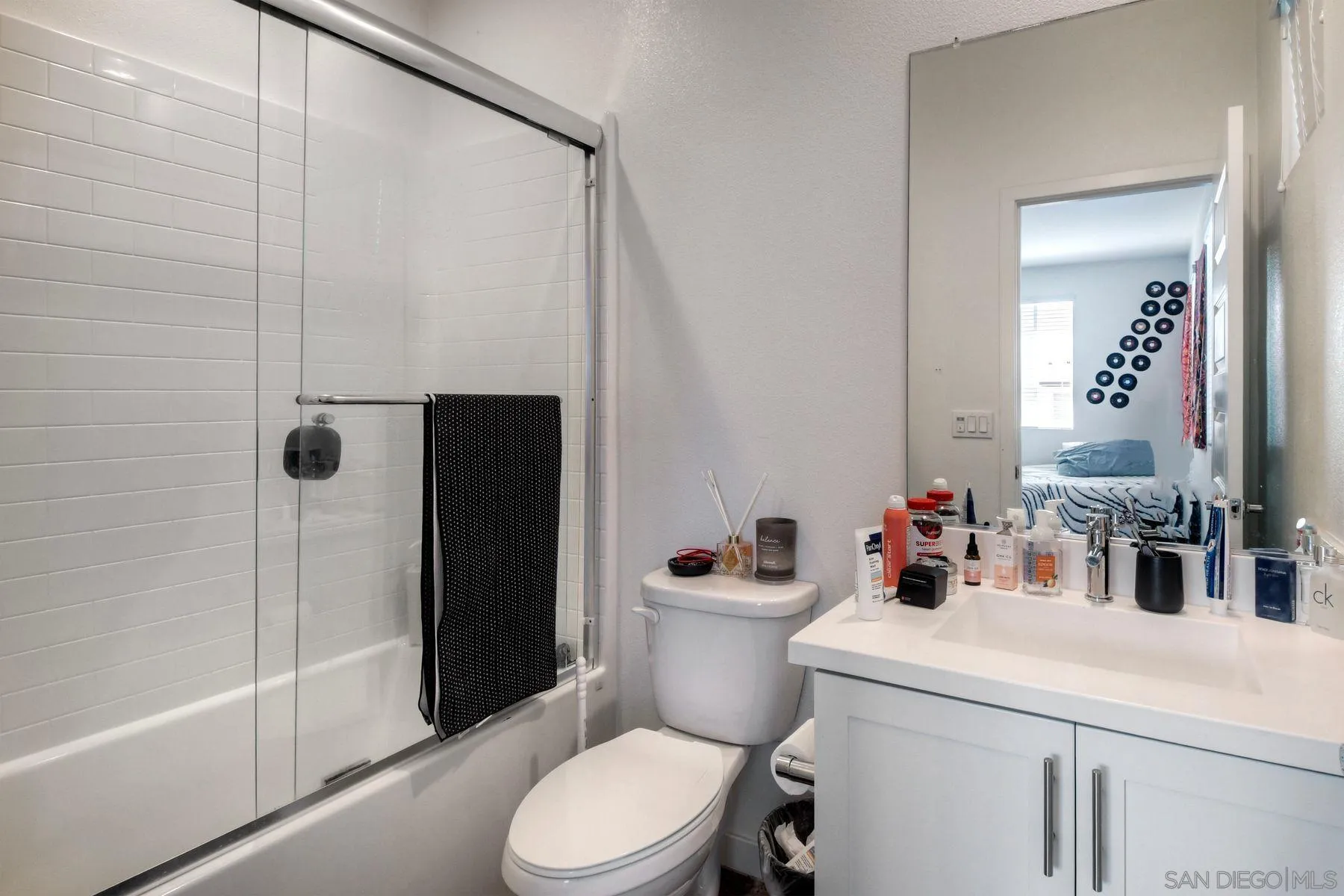 6058 Colt Place, Unit 101 Carlsbad, CA 92009 - Photo 16 of 42 a bathroom with a sink a toilet and shower