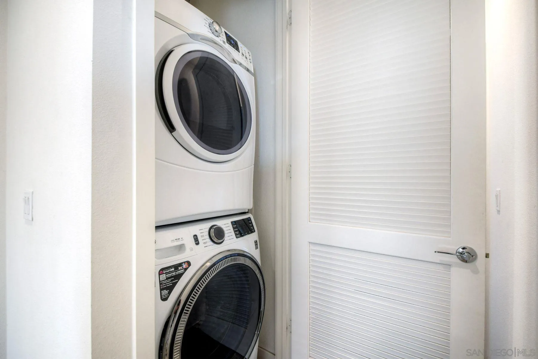 6058 Colt Place, Unit 101 Carlsbad, CA 92009 - Photo 19 of 42 a utility room with dryer and washer