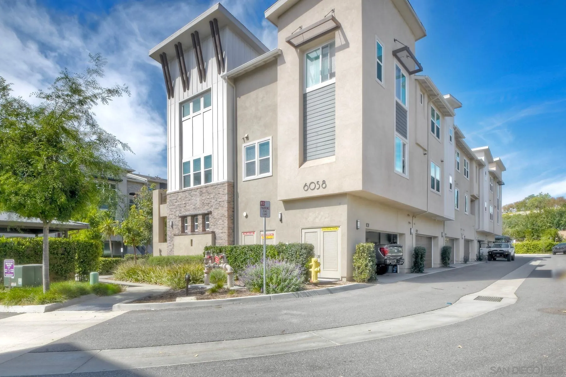 6058 Colt Place, Unit 101 Carlsbad, CA 92009 - Photo 22 of 42 a view of a building along the street