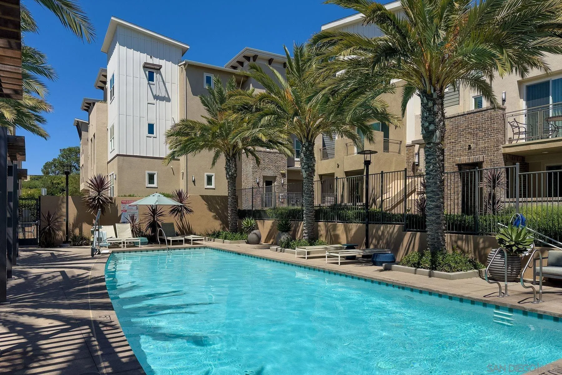 6058 Colt Place, Unit 101 Carlsbad, CA 92009 - Photo 28 of 42 a view of a house with backyard and sitting area