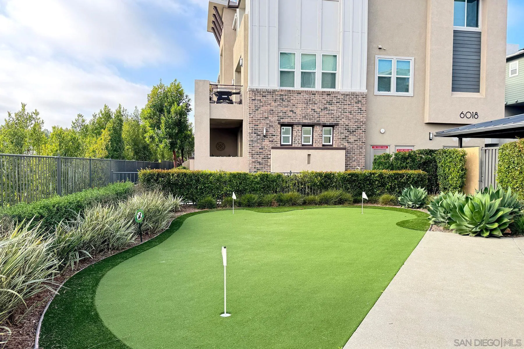 6058 Colt Place, Unit 101 Carlsbad, CA 92009 - Photo 29 of 42 a view of a house with a swimming pool