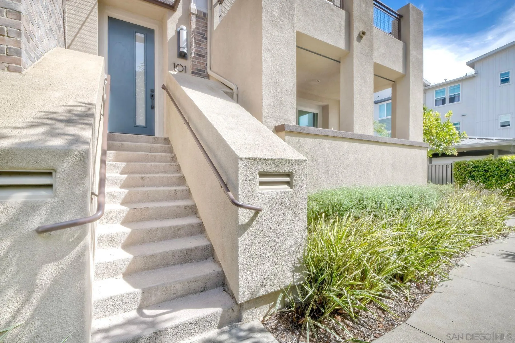 6058 Colt Place, Unit 101 Carlsbad, CA 92009 - Photo 3 of 42 a view of an entryway with staircase
