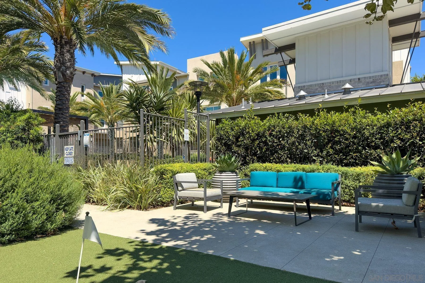 6058 Colt Place, Unit 101 Carlsbad, CA 92009 - Photo 40 of 42 a garden view with a seating space