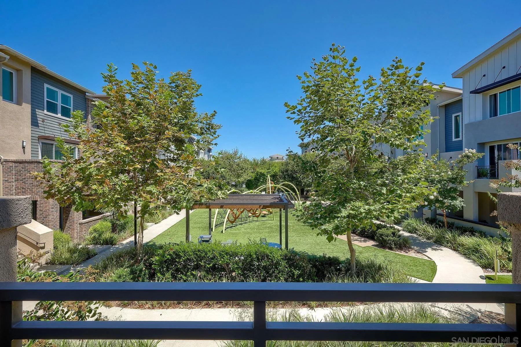 6058 Colt Place, Unit 101 Carlsbad, CA 92009 - Photo 41 of 42 a view of a garden from a balcony