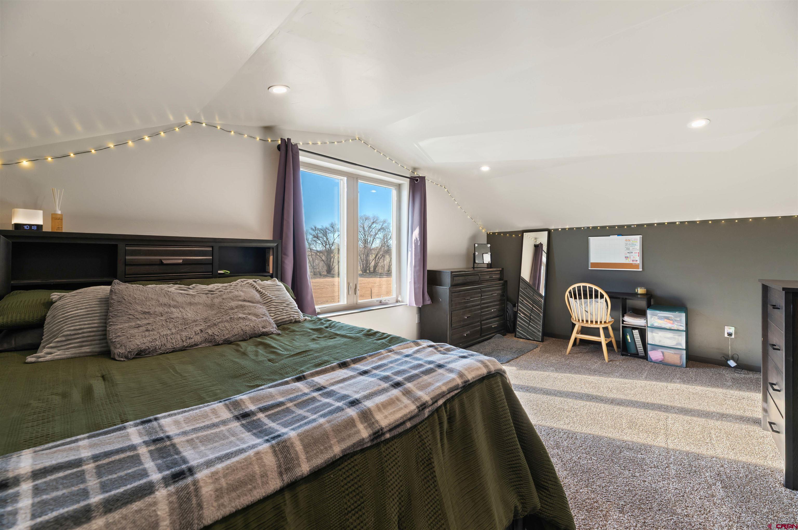 55347 Begonia Road Delta, CO 81416 - Photo 39 of 44 a bedroom with a bed and table