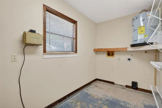a view of storage and utility room with racks on the wall