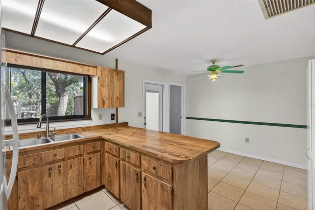 a kitchen with stainless steel appliances granite countertop a stove and a refrigerator
