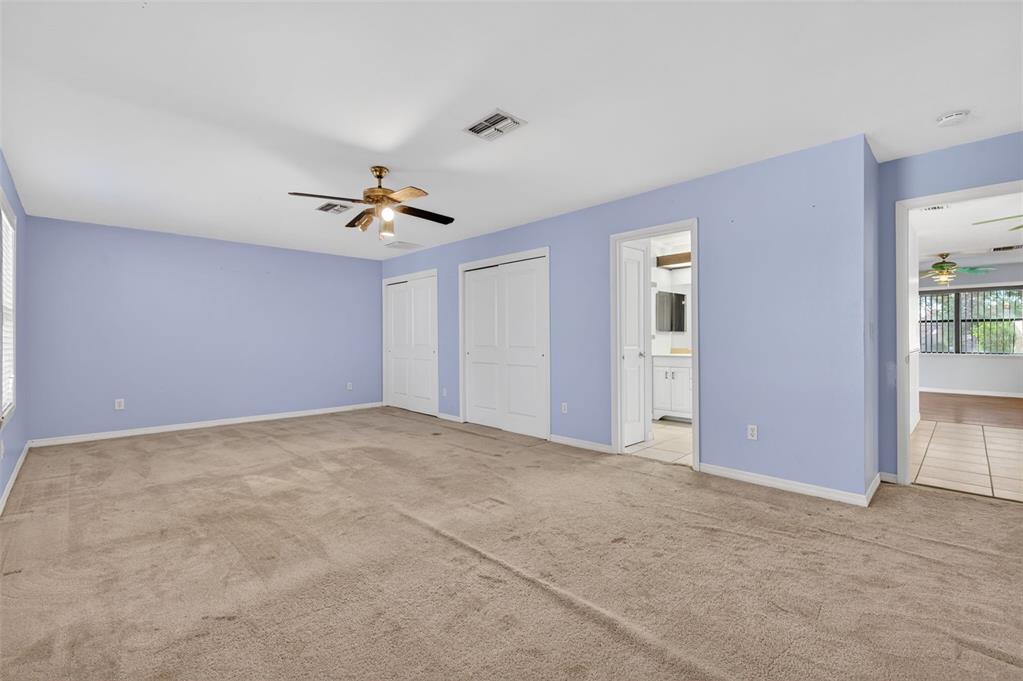 7157 Landmark Drive Spring Hill, FL 34606 - Photo 37 of 57 a view of a livingroom with a ceiling fan and window