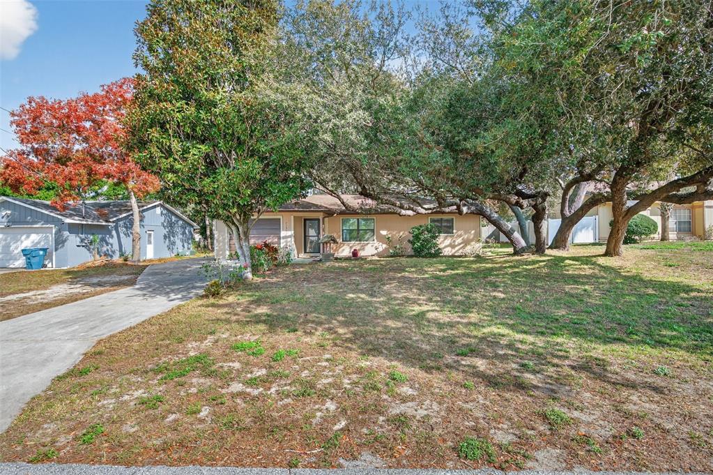 7157 Landmark Drive Spring Hill, FL 34606 - Photo 4 of 57 a front view of house with yard