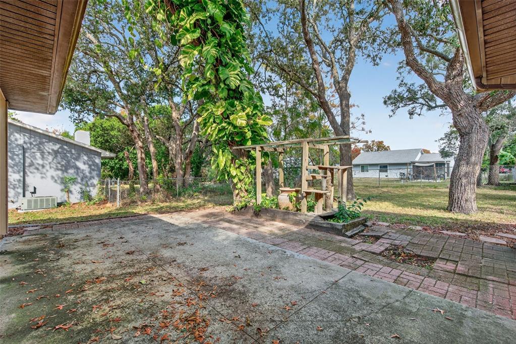 7157 Landmark Drive Spring Hill, FL 34606 - Photo 42 of 57 a view of a yard with a tree