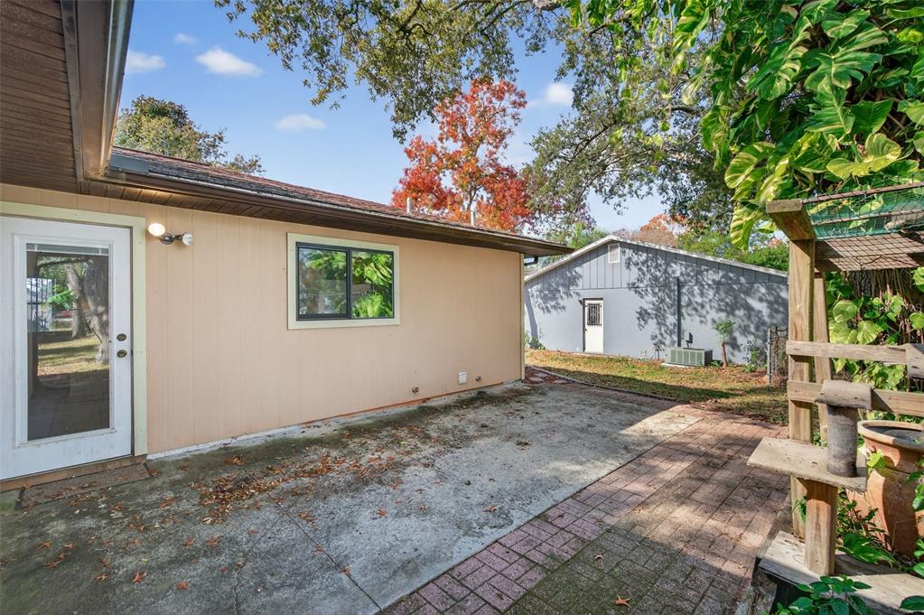 7157 Landmark Drive Spring Hill, FL 34606 - Photo 45 of 57 a view of a house with a tree in the background