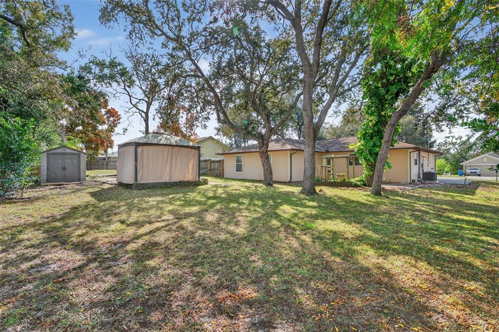 7157 Landmark Drive Spring Hill, FL 34606 - Photo 49 of 57 a house view with a garden space