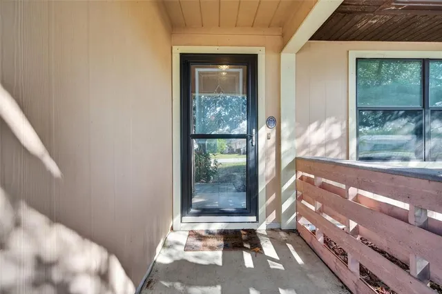 a view of a door and a window