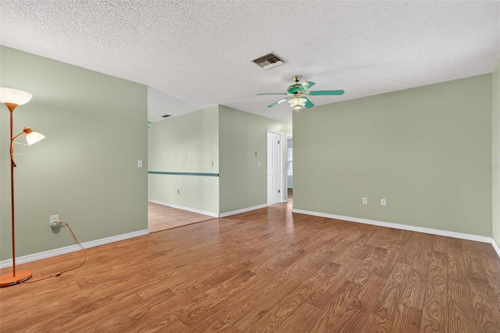7157 Landmark Drive Spring Hill, FL 34606 - Photo 8 of 57 a view of an empty room with a window