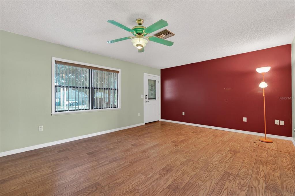 7157 Landmark Drive Spring Hill, FL 34606 - Photo 10 of 57 a view of an empty room with a window