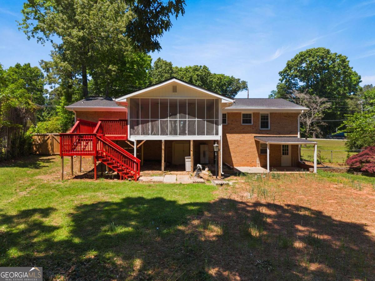 865 Old Tucker Road Stone Mountain, GA 30087 - Photo 47 of 57 a view of a house with a yard