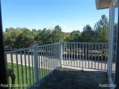 3521 Oakmonte Boulevard, Unit 74 Rochester, MI 48306 - Photo 8 of 31 Balcony off of Great Room