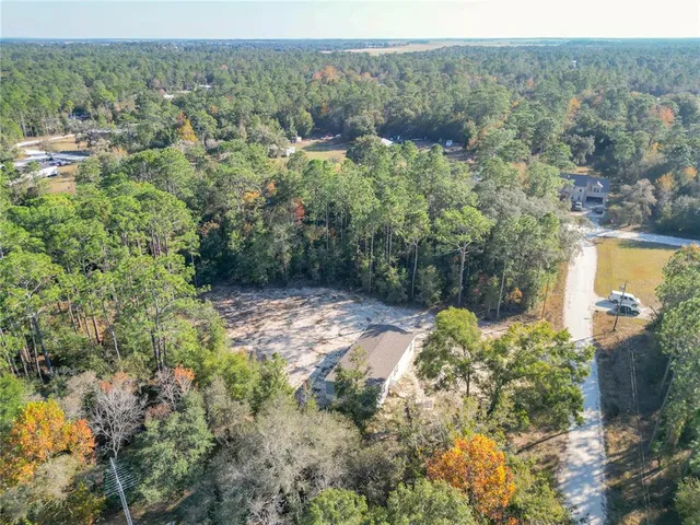 a view of a yard with a tree
