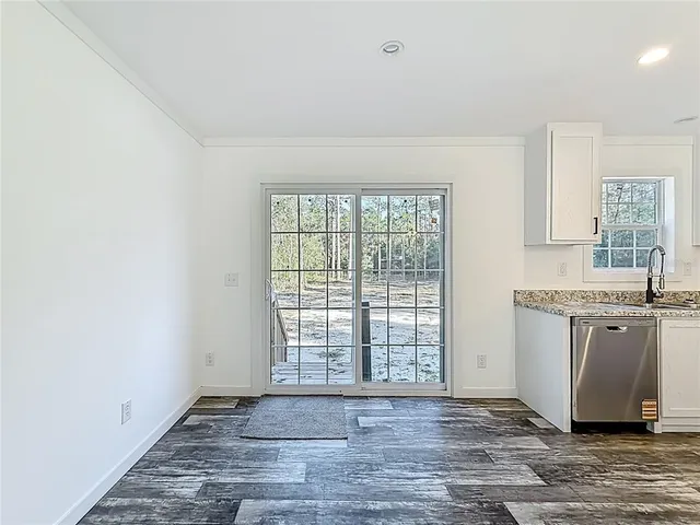 a view of room with window and ceiling fan